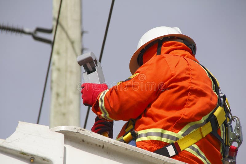 Hydro Electric Linesman Checks Voltage Reader stock photography Hydro Electric Linesman Checks Voltage Reader stock photography