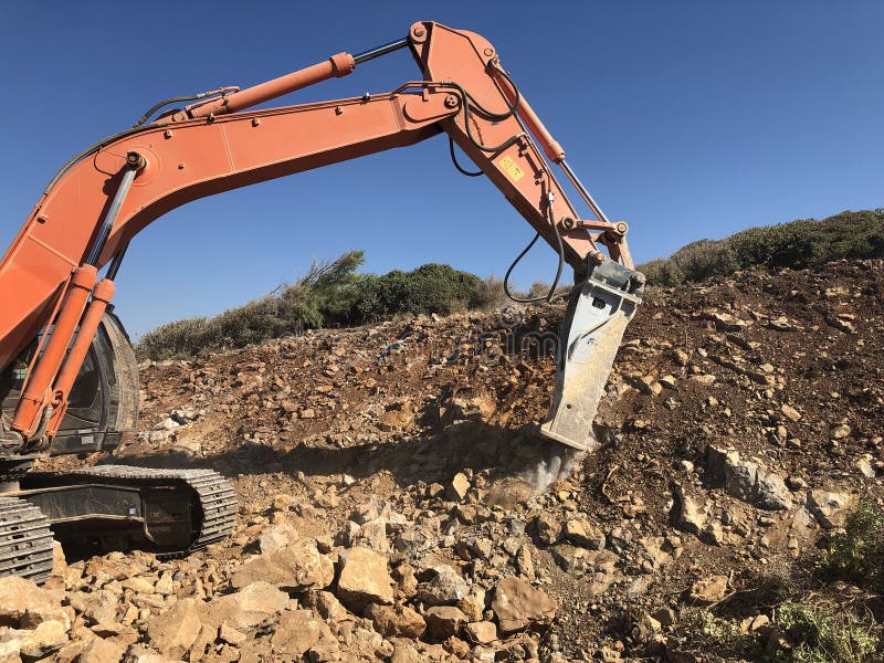 Hydrohammer is Crushing Rocks during Road Construction Works on the Rocky  Soils Stock Photo - Image of backhoe, excavate: 157811368