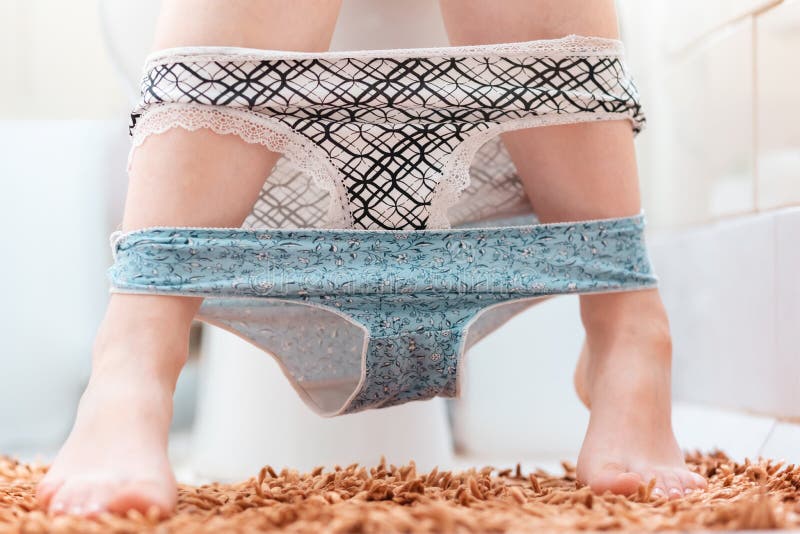 Hygiene and Cystitis. a Woman is Sitting on the Toilet with Two Panties  Removed. Close-up of the Legs Stock Image - Image of female, incontinence:  258967225