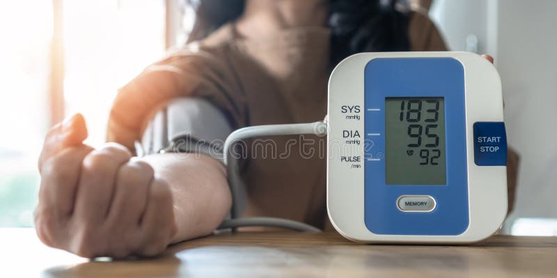 Hypertension or high blood pressure illness in patient with blood pressure monitoring, measurement on digital sphygmomanometer