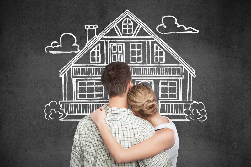 Back view of young couple looking at house sketch on dark concrete background. Mortgage and property concept. Back view of young couple looking at house sketch on dark concrete background. Mortgage and property concept