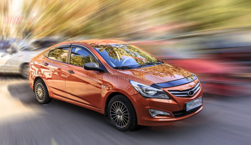 Hyundai is an orange car. stock image. Image of background - 101697029