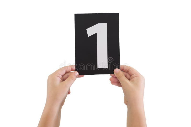 Two hands are holding a black paper card with number 1 isolated on white background. Two hands are holding a black paper card with number 1 isolated on white background