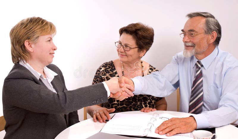 Business partners shaking hands making a agreement. Business partners shaking hands making a agreement