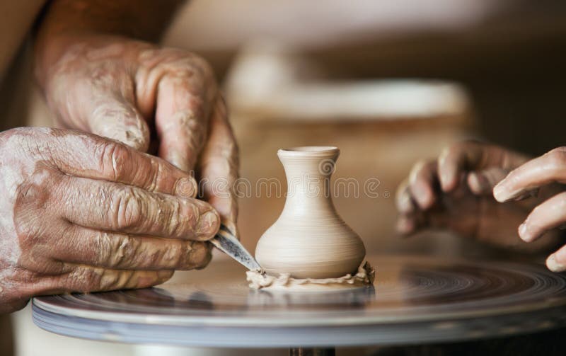 Old ceramist teaching little girl for a pottery. Old ceramist teaching little girl for a pottery