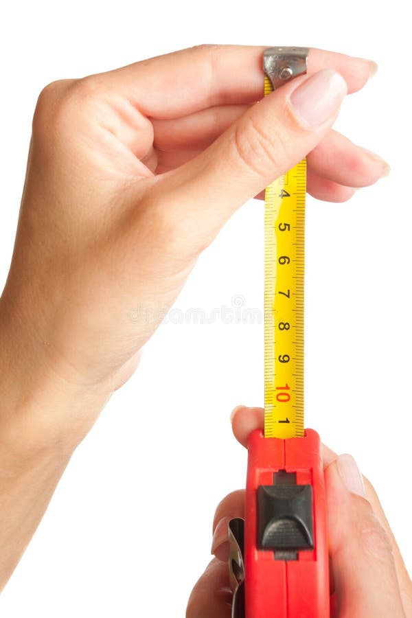 Tape measure in female hands. Isolated. Tape measure in female hands. Isolated.