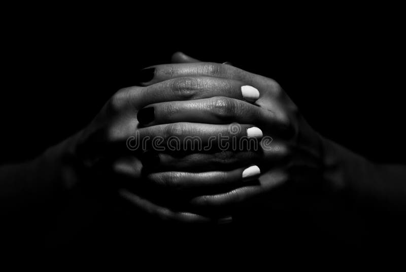 Photo of two hands together, on black background. Nails are painted in black and white color, symbolising yin yang. Her hands and fingers are bony. This picture symbolizes togetherness of good and bad. Photo of two hands together, on black background. Nails are painted in black and white color, symbolising yin yang. Her hands and fingers are bony. This picture symbolizes togetherness of good and bad.