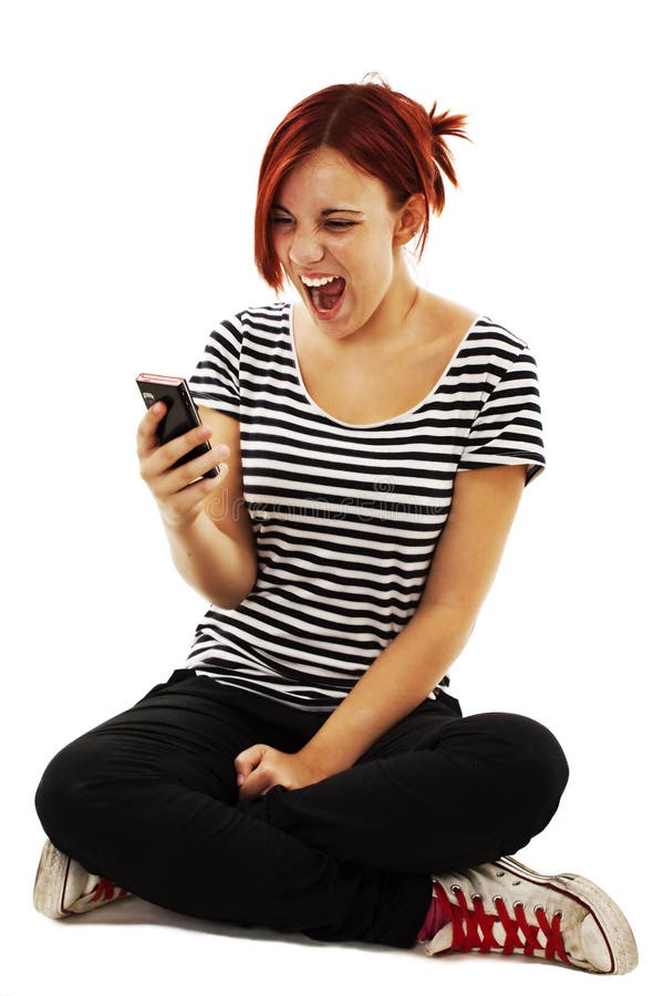 Beautiful girl screaming in the phone. Isolated on white background. Beautiful girl screaming in the phone. Isolated on white background.