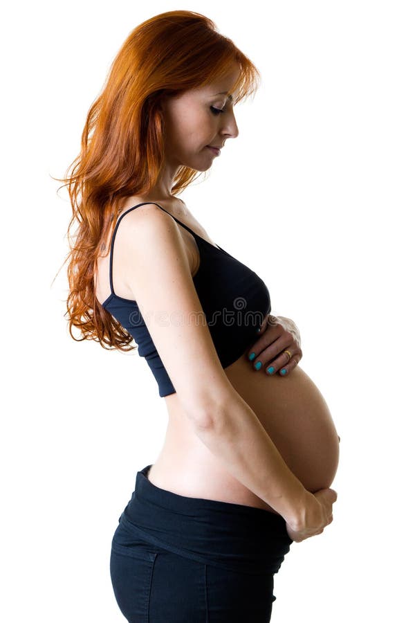 Härlig gravid kvinna som hemma kopplar av fotografering för bildbyråer Härlig gravid kvinna som hemma kopplar av fotografering för bildbyråer
