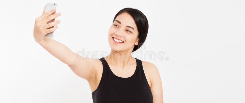 Härlig lycklig flicka att göra isolerad selfie på vit arkivbilder Härlig lycklig flicka att göra isolerad selfie på vit arkivbilder