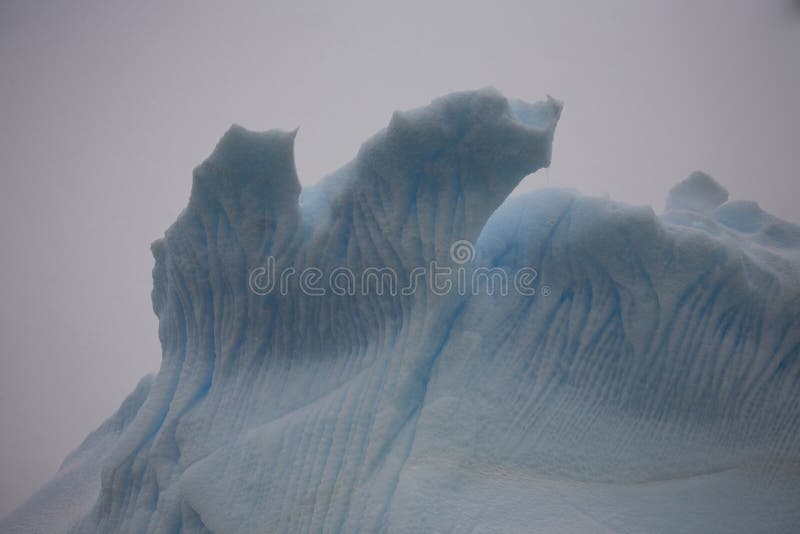 An iceberg is a large piece of ice from freshwater that has broken off from a snow-formed glacier or ice shelf and is floating in open water. An iceberg is a large piece of ice from freshwater that has broken off from a snow-formed glacier or ice shelf and is floating in open water.