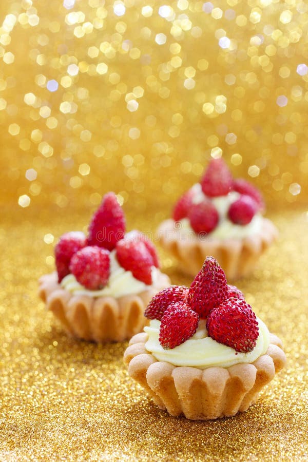 Beautiful tiny cupcakes with wild strawberries. Party time. Beautiful tiny cupcakes with wild strawberries. Party time
