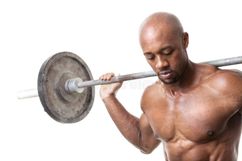 Toned and ripped lean muscle fitness man lifting weights isolated over a white background. Toned and ripped lean muscle fitness man lifting weights isolated over a white background.