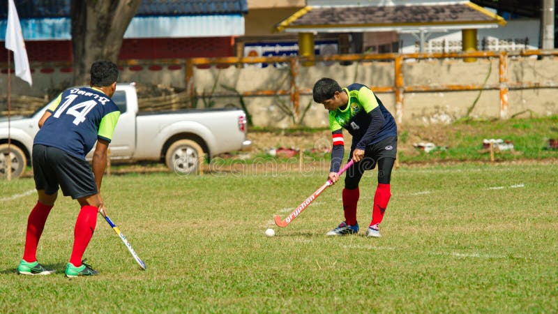 hóquei exterior Jogador de hóquei na ação durante os jogos nacionais de Tailândia fotos de stock hóquei exterior Jogador de hóquei na ação durante os jogos nacionais de Tailândia fotos de stock
