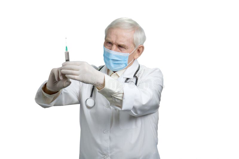Hög doktor som förbereder injektionssprutan för injektion royaltyfria foton Hög doktor som förbereder injektionssprutan för injektion royaltyfria foton