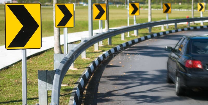 Series of chevrons arrows indicating a bend in a road. Series of chevrons arrows indicating a bend in a road