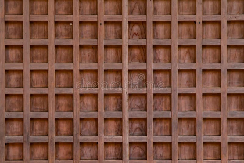 Close up of a light brown wood panel revealing it`s checkered pattern. Close up of a light brown wood panel revealing it`s checkered pattern.