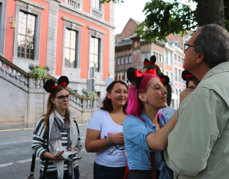 A local custom is for the bride to dress up with her girlfriends and go around town. This bride's friends put on Mickey Mouse ears and sold bow ties for 2 euros. A local custom is for the bride to dress up with her girlfriends and go around town. This bride's friends put on Mickey Mouse ears and sold bow ties for 2 euros.