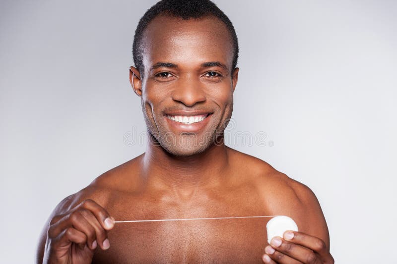 Hübsch mit Zahnseide. lizenzfreies stockfoto Hübsch mit Zahnseide. lizenzfreies stockfoto