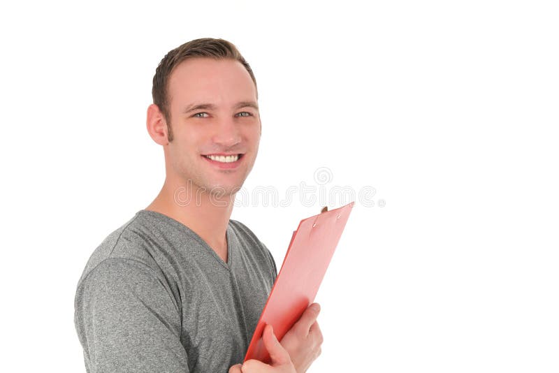 Hübscher lächelnder Mann, der ein Klemmbrett hält stockfotografie Hübscher lächelnder Mann, der ein Klemmbrett hält stockfotografie