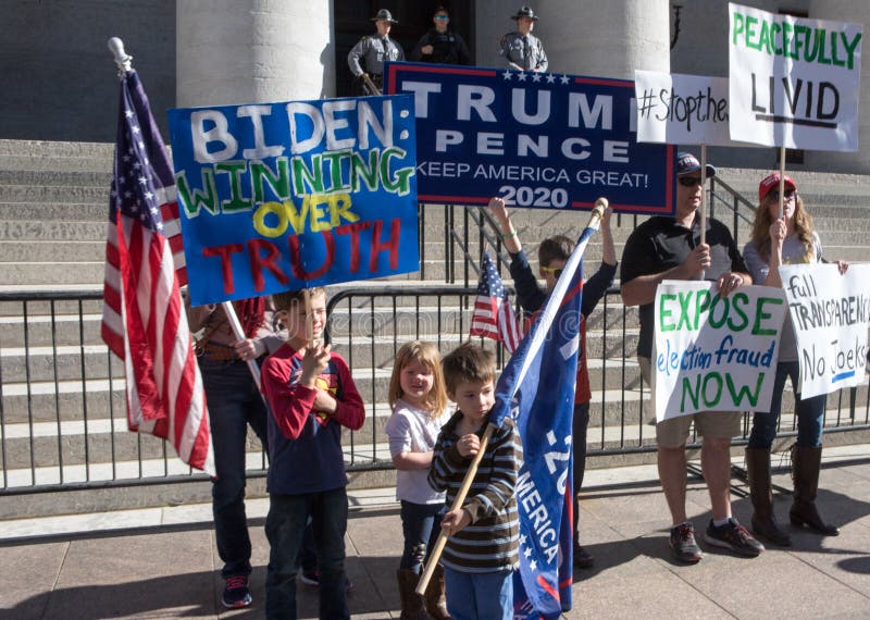 A group of children hold signs supporting Donald Trump at a Stop the Steal rally, shortly after Joe Biden was announced as the winner of the election. Rally attendees insist that the 2020 election was won by Biden through widespread voter fraud. Columbus, Ohio. November 7th 2020. A group of children hold signs supporting Donald Trump at a Stop the Steal rally, shortly after Joe Biden was announced as the winner of the election. Rally attendees insist that the 2020 election was won by Biden through widespread voter fraud. Columbus, Ohio. November 7th 2020