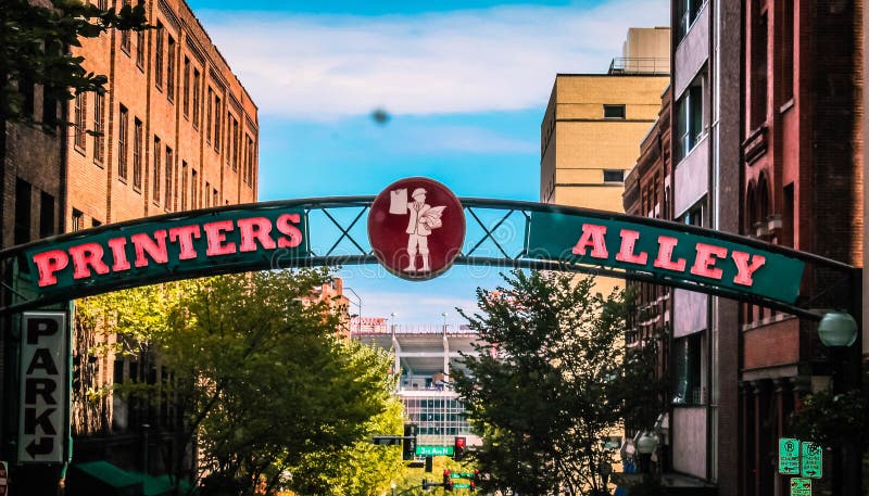 Traditionally the center of Nashville’s nightlife, Printers Alley was, in its earlier days, a series of posts where men bound for the courthouse hitched their horses. By the turn of the twentieth century it had become the center of Nashville’s printing industry; in its heyday, circa 1915, thirteen publishers and ten printers were located in the area serviced by the alley. Nashville’s two largest newspapers, The Tennessean and the Nashville Banner, had their offices here at one time. Traditionally the center of Nashville’s nightlife, Printers Alley was, in its earlier days, a series of posts where men bound for the courthouse hitched their horses. By the turn of the twentieth century it had become the center of Nashville’s printing industry; in its heyday, circa 1915, thirteen publishers and ten printers were located in the area serviced by the alley. Nashville’s two largest newspapers, The Tennessean and the Nashville Banner, had their offices here at one time.