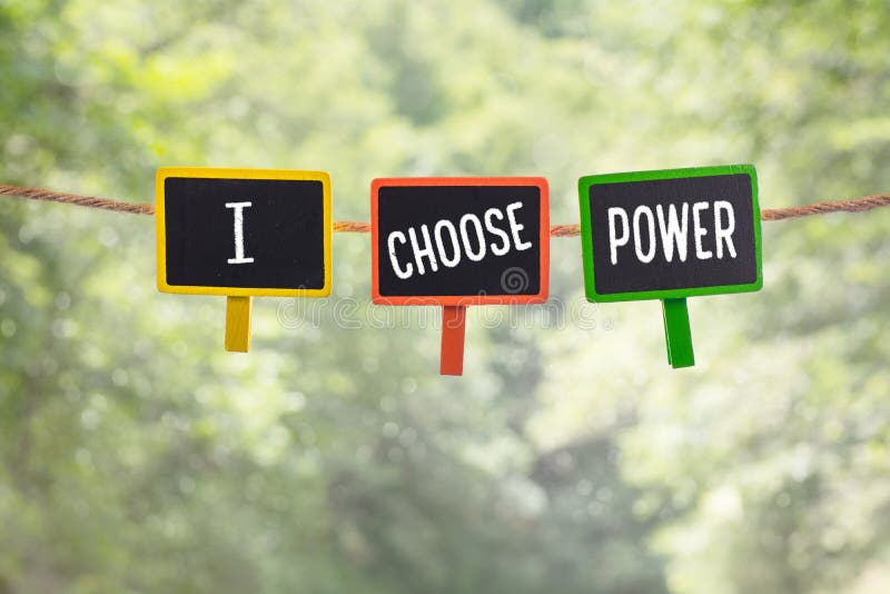 I choose power written on color small chalkboard linked rope with clothespin on nature green bokeh light background. I choose power written on color small chalkboard linked rope with clothespin on nature green bokeh light background