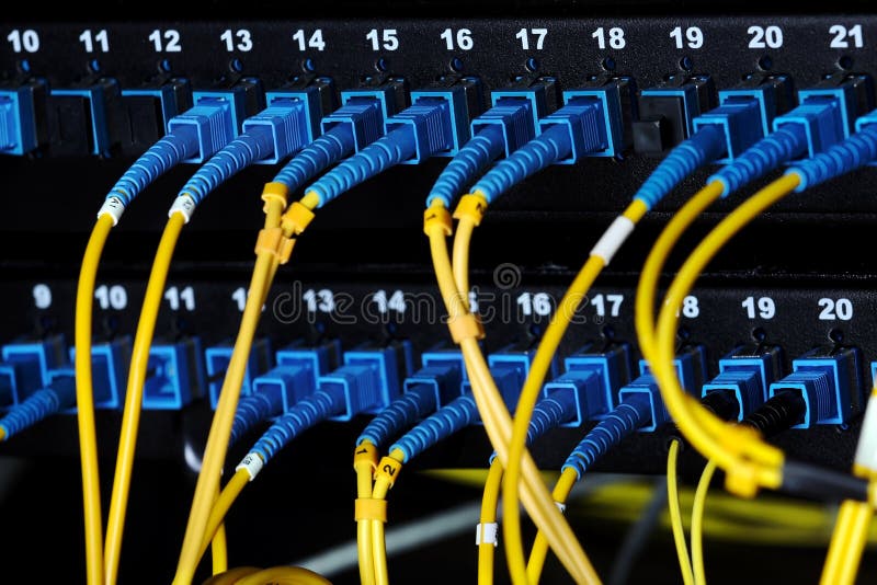 Blue optical connectors switch on the patch panel and yellow wires. Blue optical connectors switch on the patch panel and yellow wires