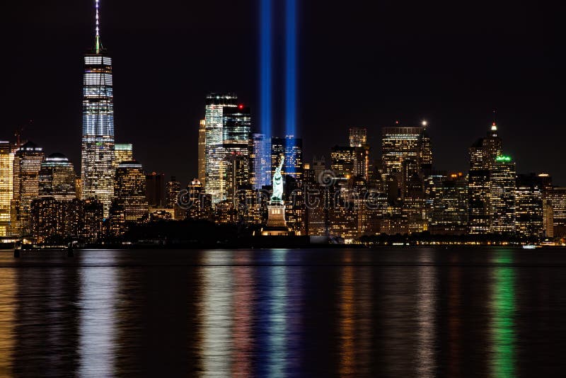 9/11 Memorial Beams with Statue of Liberty and Lower Manhattan. 9/11 Memorial Beams with Statue of Liberty and Lower Manhattan.