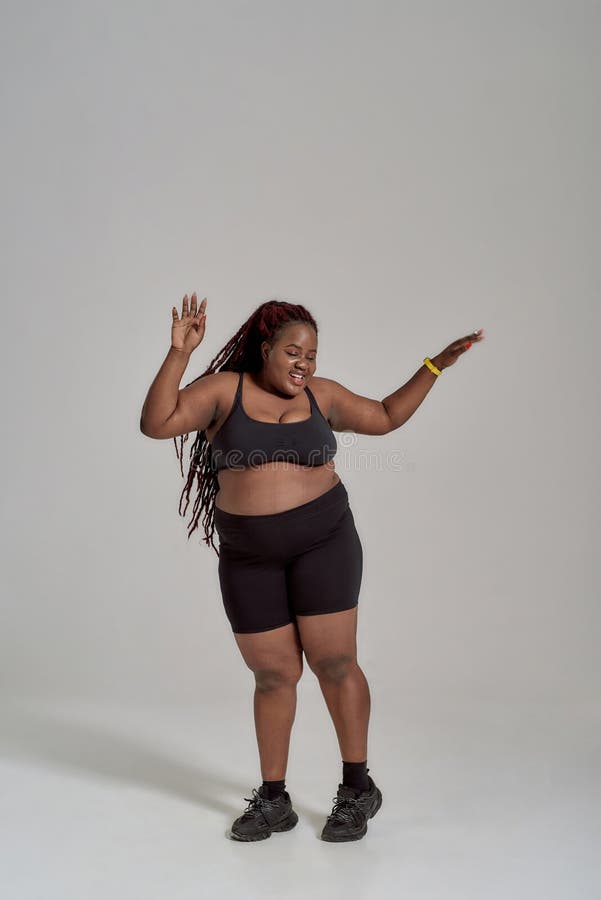 Love Curves. Full Length Shot of Plump, Plus Size African American in Sportswear Having Fun, in Stock Image - Image of looking, attractive: 189108421