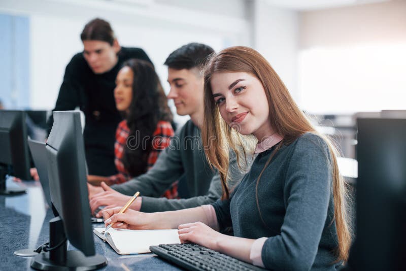 I love my work. Group of young people in casual clothes in the modern office stock photo I love my work. Group of young people in casual clothes in the modern office stock photo
