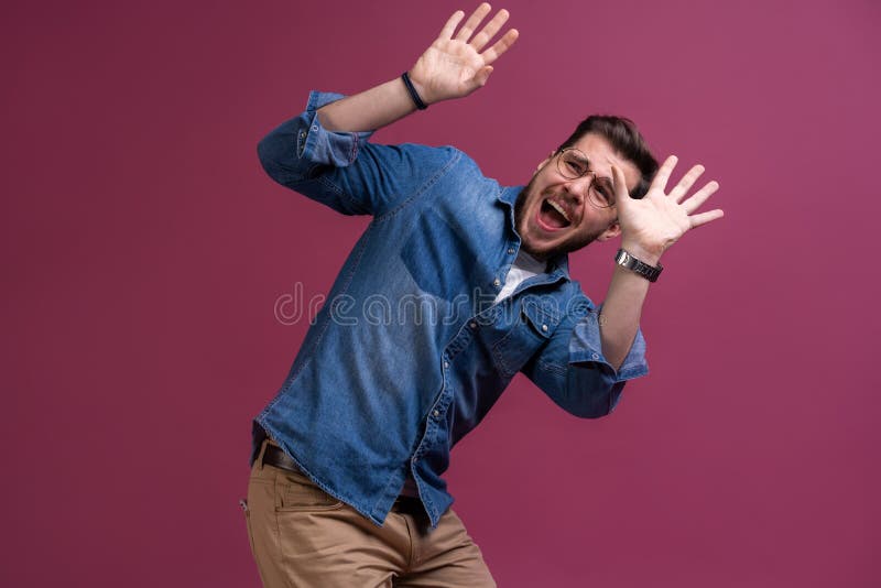 I`m afraid. Fright. Scared man. Business man standing isolated on trendy pink studio background. Human emotions, facial stock image I`m afraid. Fright. Scared man. Business man standing isolated on trendy pink studio background. Human emotions, facial stock image