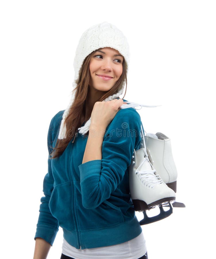 I pattini da ghiaccio della tenuta della donna per il pattinaggio su ghiaccio dell'inverno mettono in mostra l'attività immagini stock I pattini da ghiaccio della tenuta della donna per il pattinaggio su ghiaccio dell'inverno mettono in mostra l'attività immagini stock