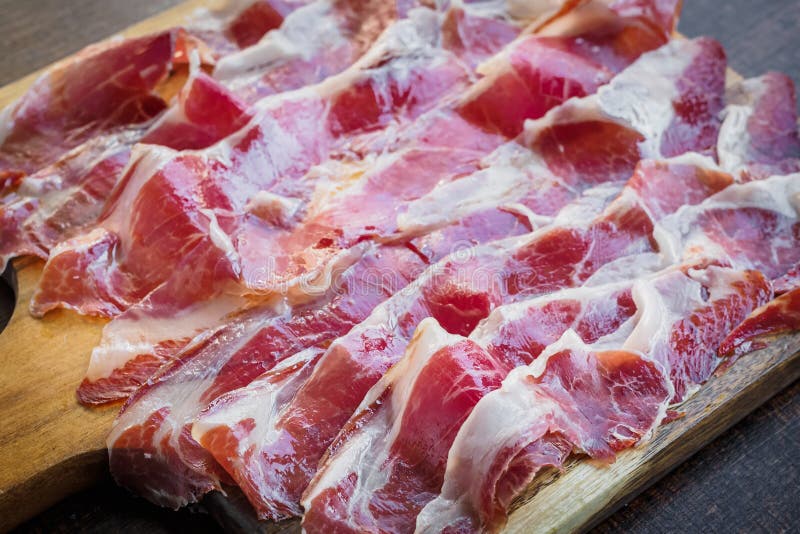 Iberico Ham Cut on a Wooden Board Stock Photo Image of lomo, olive