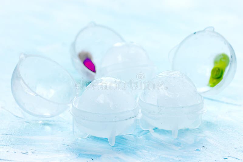 Ice Balls for Cooling Drinks in Plastic Molds on a Blue Background Stock Photo Image of