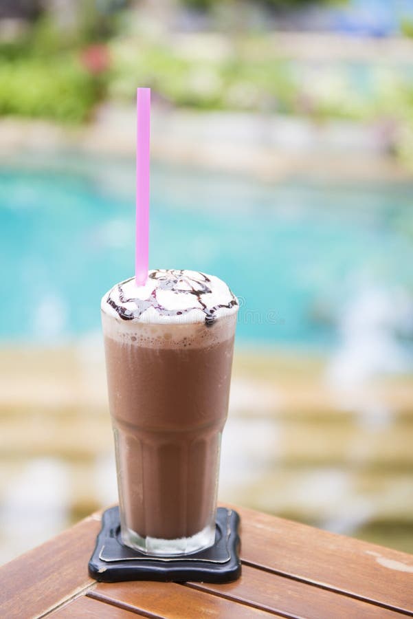 Cold Chocolate Milk with Whipped Cream in Plastic Glass Stock Photo
