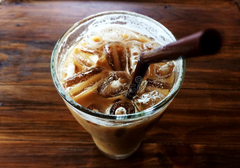 ice coffee in glass and brown tube