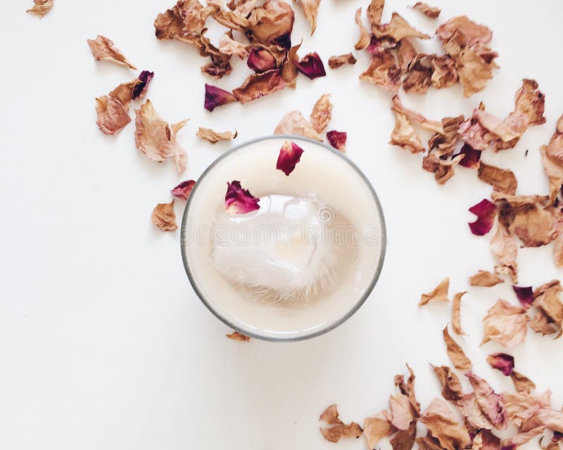 Ice coffee and rose petals