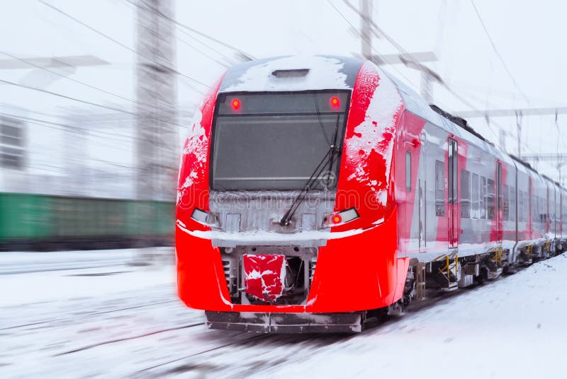 Icecovered Multipleunit Train Rides by Rail in Winter Stock Image