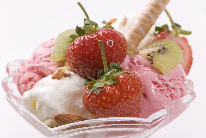 Ice cream strawberries kiwi in glass vase