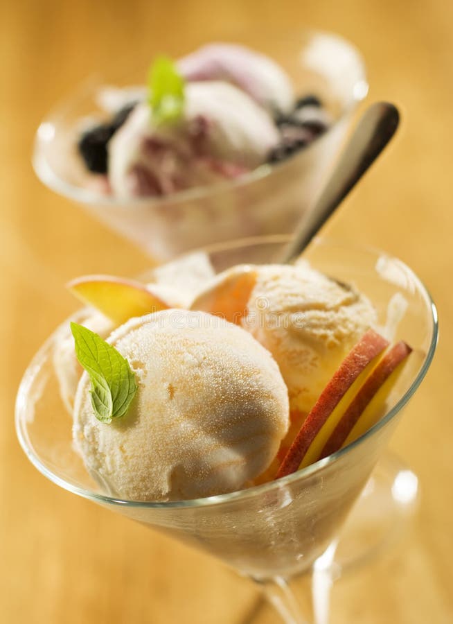 Refreshing peach ice cream in tall glass close up