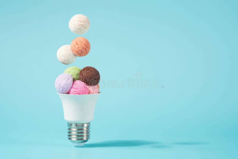 Ice Cream Balls Falling into the Light Bulb Cone. Stock Photo Image