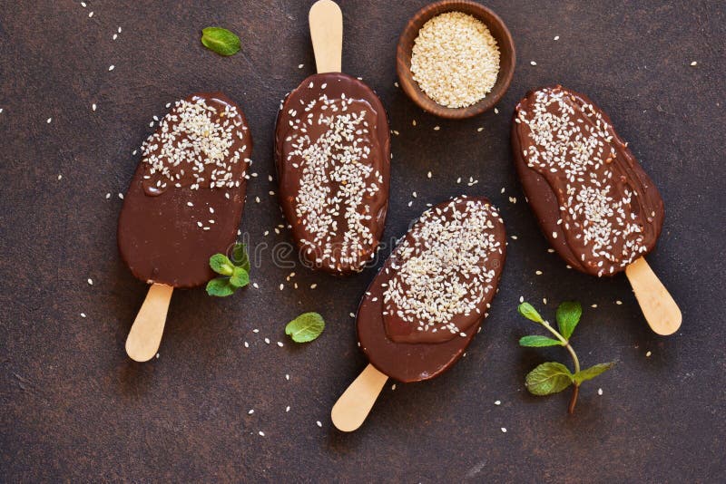 Ice Cream with Chocolate and Sesame on a Concrete Background. Popsicle