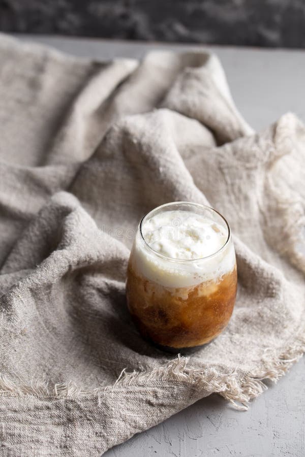 Ice Cream with Coffee Cocktail in Glass on Grey Fabric Stock Image