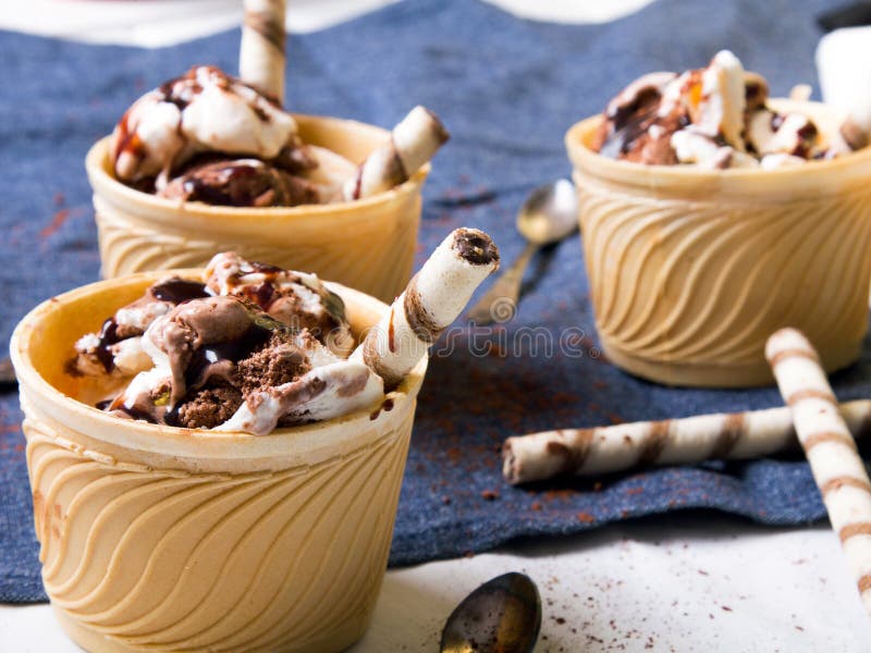 Delicious ice cream in a cup with chocolate sauce cream rolls. Ceram stock images, royalty-free photos and pictures