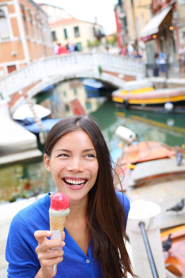 Ice cream eating woman in Venice, Italy royalty free stock photo Ice cream eating woman in Venice, Italy royalty free stock photo