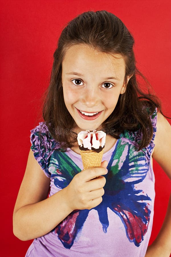 Ice Cream Little Girl Excited and Happy Eating Ice Cream Stock Photo