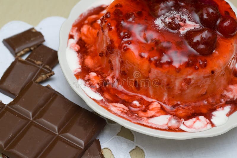 Ice-cream poured with cherry jam.