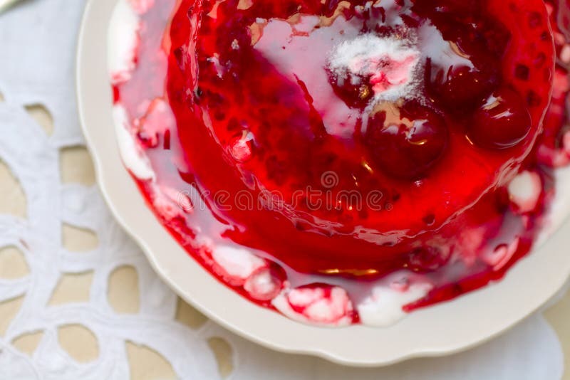 Ice-cream poured with sweet cherry jam