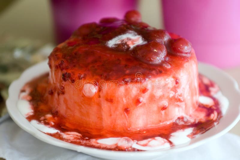 Ice-cream poured with sweet cherry jam